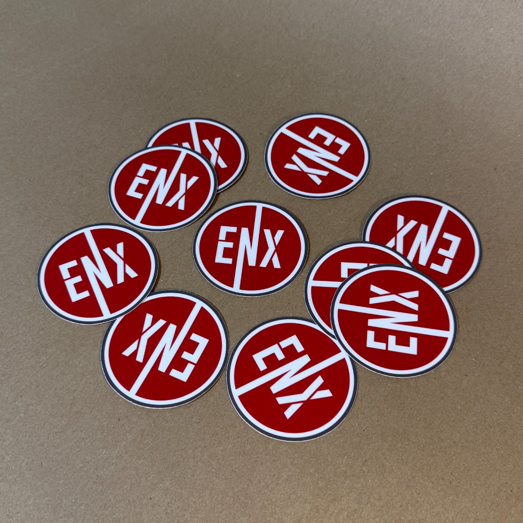ENX Stickers scattered on a surface